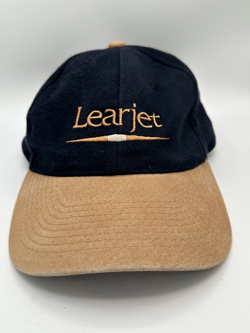 Learjet black and tan low profile adjustable hat/cap